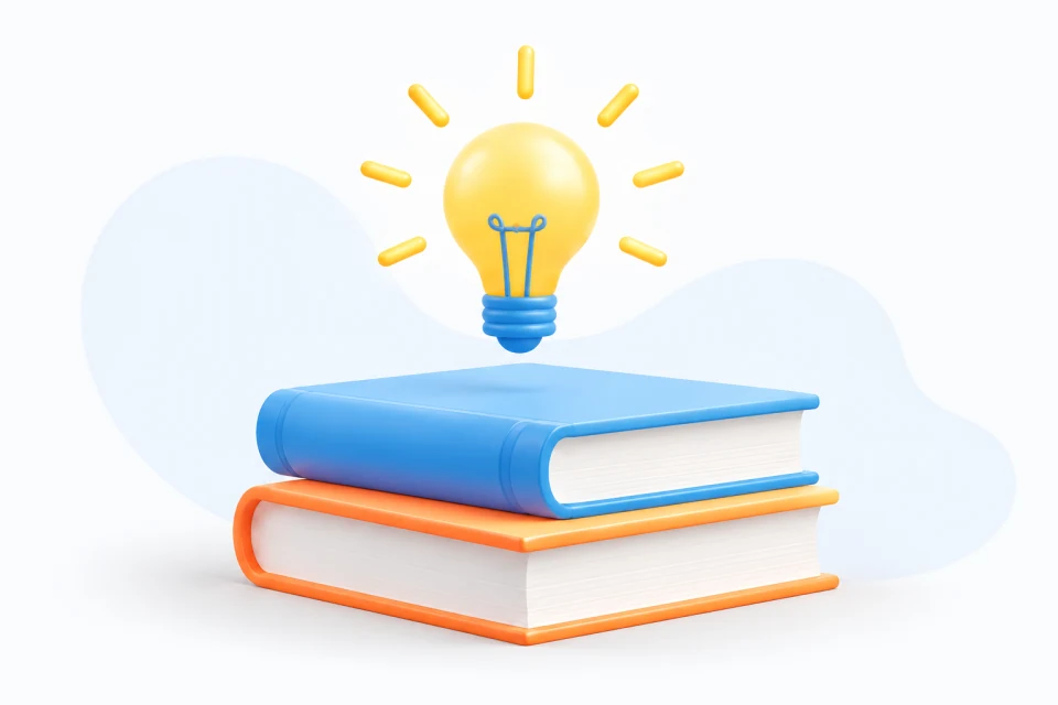 A glowing yellow lightbulb above stacked blue and orange books